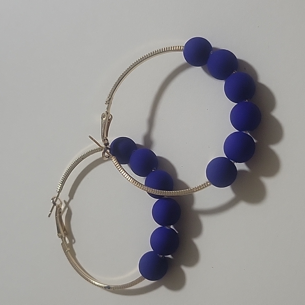 Women blue and gold beaded earrings